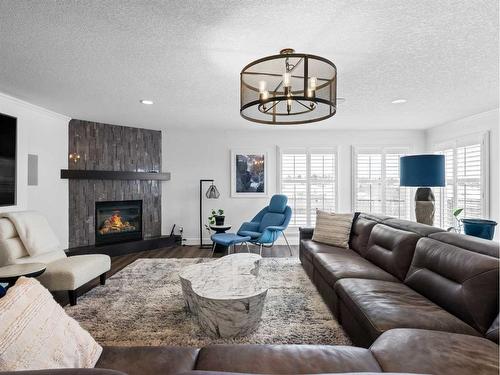 31 Cherry Valley Court, Rural Rocky View County, AB - Indoor Photo Showing Living Room With Fireplace