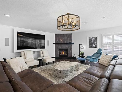 31 Cherry Valley Court, Rural Rocky View County, AB - Indoor Photo Showing Living Room With Fireplace