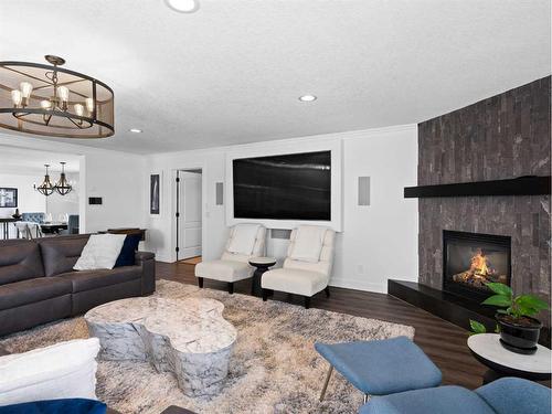 31 Cherry Valley Court, Rural Rocky View County, AB - Indoor Photo Showing Living Room With Fireplace