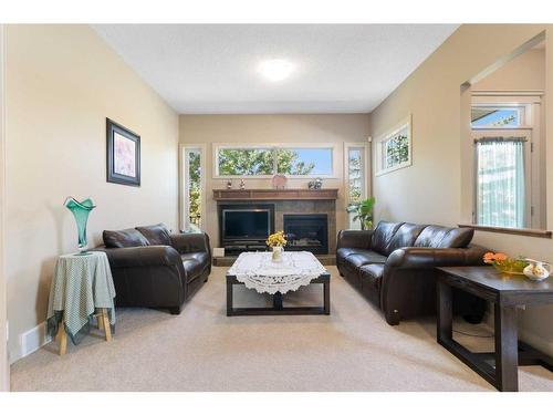 129 Royal Oak Heath Nw, Calgary, AB - Indoor Photo Showing Living Room With Fireplace