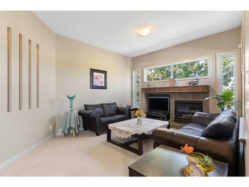 129 Royal Oak Heath Nw, Calgary, AB - Indoor Photo Showing Living Room With Fireplace