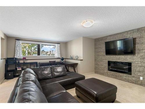 129 Royal Oak Heath Nw, Calgary, AB - Indoor Photo Showing Living Room With Fireplace