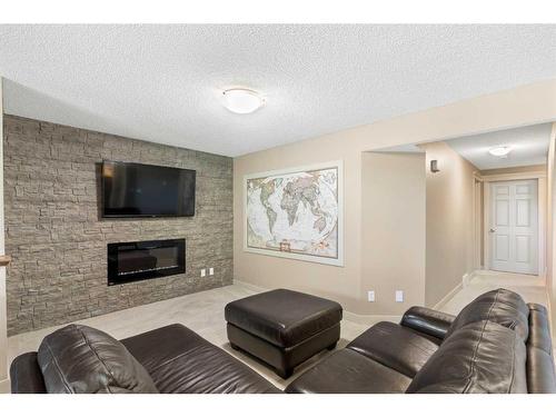 129 Royal Oak Heath Nw, Calgary, AB - Indoor Photo Showing Living Room With Fireplace