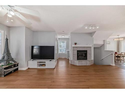 27 Sandarac Villas Nw, Calgary, AB - Indoor Photo Showing Living Room With Fireplace