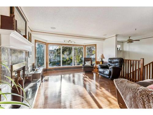 612 Hunterston Bay Nw, Calgary, AB - Indoor Photo Showing Living Room With Fireplace