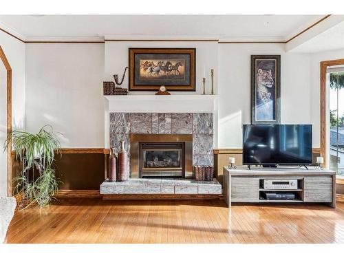 612 Hunterston Bay Nw, Calgary, AB - Indoor Photo Showing Living Room With Fireplace