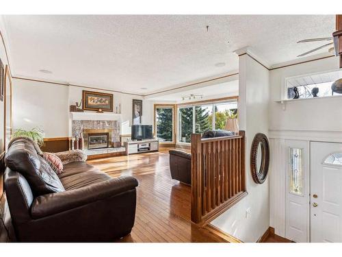 612 Hunterston Bay Nw, Calgary, AB - Indoor Photo Showing Living Room With Fireplace