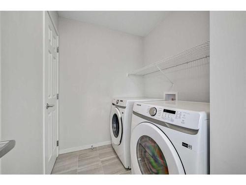 9 Carringwood Grove Nw, Calgary, AB - Indoor Photo Showing Laundry Room