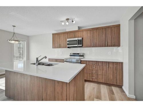 9 Carringwood Grove Nw, Calgary, AB - Indoor Photo Showing Kitchen With Double Sink