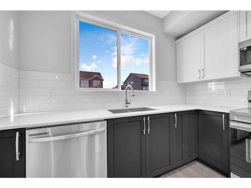 115 Aquila Drive Nw, Calgary, AB - Indoor Photo Showing Kitchen With Double Sink With Upgraded Kitchen