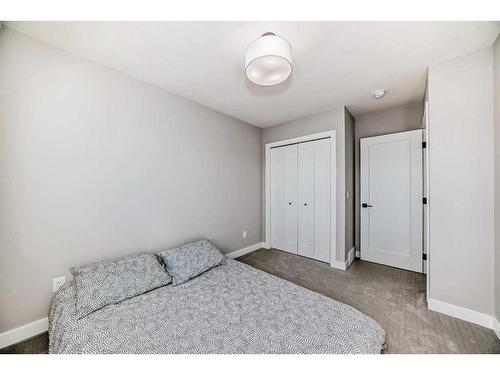 126 Dawson Harbour Grove, Chestermere, AB - Indoor Photo Showing Bedroom