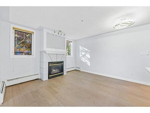 104-2419 Erlton Road Sw, Calgary, AB - Indoor With Fireplace