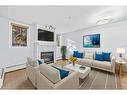 104-2419 Erlton Road Sw, Calgary, AB  - Indoor Photo Showing Living Room With Fireplace 