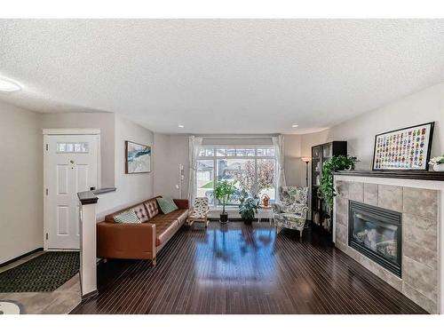 239 Sage Bank Grove Nw, Calgary, AB - Indoor Photo Showing Living Room With Fireplace