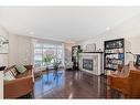 239 Sage Bank Grove Nw, Calgary, AB  - Indoor Photo Showing Living Room With Fireplace 