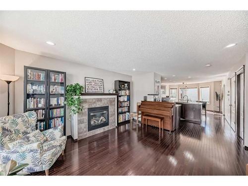 239 Sage Bank Grove Nw, Calgary, AB - Indoor Photo Showing Living Room With Fireplace