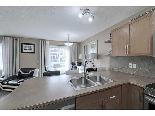 1204-800 Yankee Valley Boulevard Se, Airdrie, AB - Indoor Photo Showing Kitchen With Double Sink