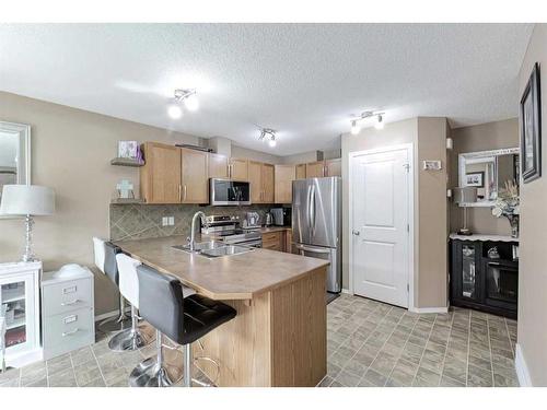 1204-800 Yankee Valley Boulevard Se, Airdrie, AB - Indoor Photo Showing Kitchen With Stainless Steel Kitchen With Double Sink