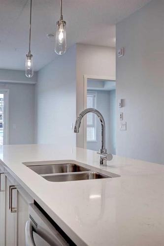 4201-550 Belmont Street Sw, Calgary, AB - Indoor Photo Showing Kitchen With Double Sink