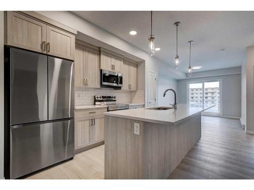 4201-550 Belmont Street Sw, Calgary, AB - Indoor Photo Showing Kitchen With Upgraded Kitchen