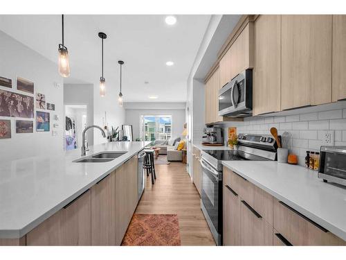 3409-220 Seton Grove Se, Calgary, AB - Indoor Photo Showing Kitchen With Double Sink With Upgraded Kitchen