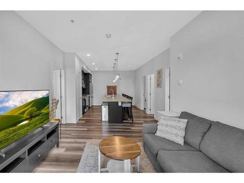 307-4150 Seton Drive Se, Calgary, AB - Indoor Photo Showing Living Room