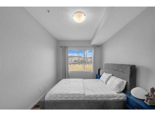 307-4150 Seton Drive Se, Calgary, AB - Indoor Photo Showing Bedroom