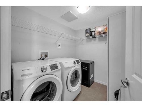 307-4150 Seton Drive Se, Calgary, AB - Indoor Photo Showing Laundry Room