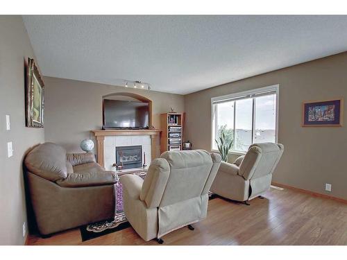 12 Panorama Hills Cove Nw, Calgary, AB - Indoor Photo Showing Living Room With Fireplace