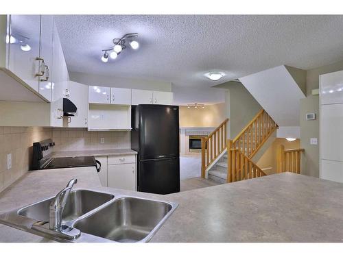 212 Scenic Acres Terrace Nw, Calgary, AB - Indoor Photo Showing Kitchen With Double Sink