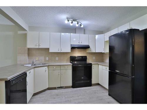 212 Scenic Acres Terrace Nw, Calgary, AB - Indoor Photo Showing Kitchen With Double Sink