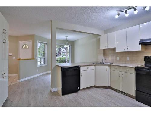 212 Scenic Acres Terrace Nw, Calgary, AB - Indoor Photo Showing Kitchen With Double Sink