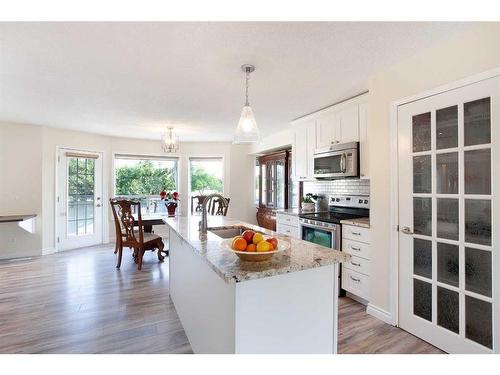 93 Shawbrooke Green Sw, Calgary, AB - Indoor Photo Showing Kitchen With Double Sink With Upgraded Kitchen