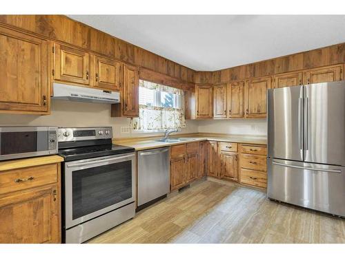 51 Woodfern Rise Sw, Calgary, AB - Indoor Photo Showing Kitchen With Stainless Steel Kitchen With Double Sink