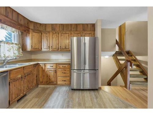 51 Woodfern Rise Sw, Calgary, AB - Indoor Photo Showing Kitchen With Double Sink