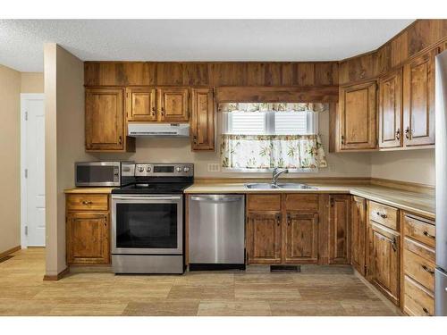 51 Woodfern Rise Sw, Calgary, AB - Indoor Photo Showing Kitchen With Stainless Steel Kitchen With Double Sink