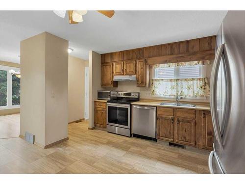 51 Woodfern Rise Sw, Calgary, AB - Indoor Photo Showing Kitchen With Stainless Steel Kitchen With Double Sink