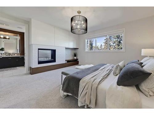 1722 47 Avenue Sw, Calgary, AB - Indoor Photo Showing Bedroom With Fireplace