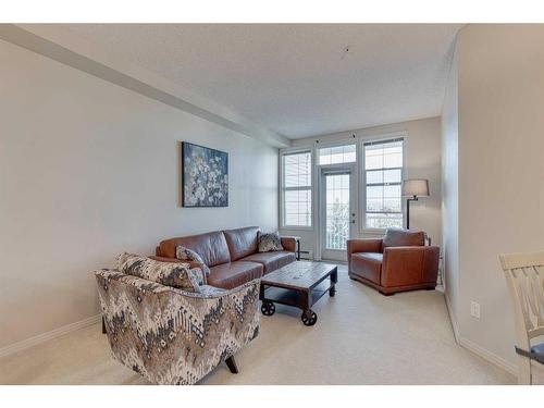 308-1 Crystal Green Lane, Okotoks, AB - Indoor Photo Showing Living Room