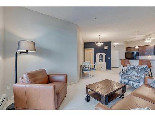 308-1 Crystal Green Lane, Okotoks, AB - Indoor Photo Showing Living Room