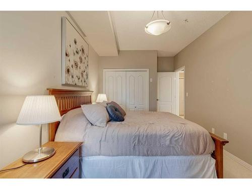 308-1 Crystal Green Lane, Okotoks, AB - Indoor Photo Showing Bedroom