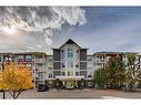 308-1 Crystal Green Lane, Okotoks, AB  - Outdoor With Balcony With Facade 