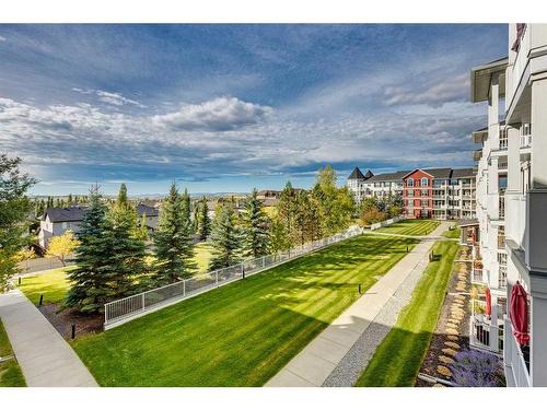 308-1 Crystal Green Lane, Okotoks, AB - Outdoor With Body Of Water With View