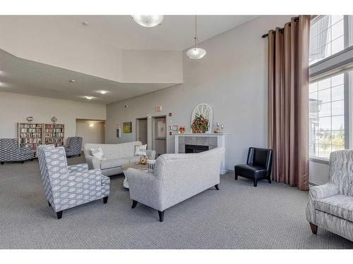 308-1 Crystal Green Lane, Okotoks, AB - Indoor Photo Showing Living Room