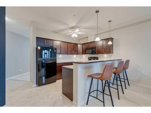 308-1 Crystal Green Lane, Okotoks, AB - Indoor Photo Showing Kitchen