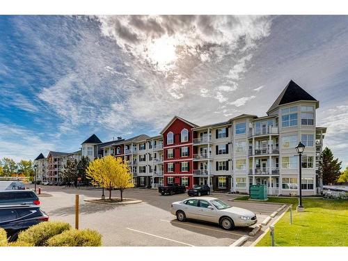 308-1 Crystal Green Lane, Okotoks, AB - Outdoor With Balcony With Facade