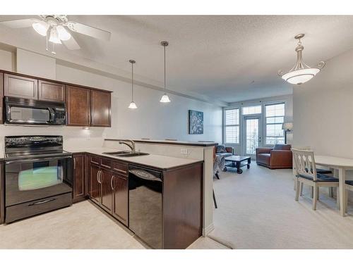 308-1 Crystal Green Lane, Okotoks, AB - Indoor Photo Showing Kitchen With Double Sink