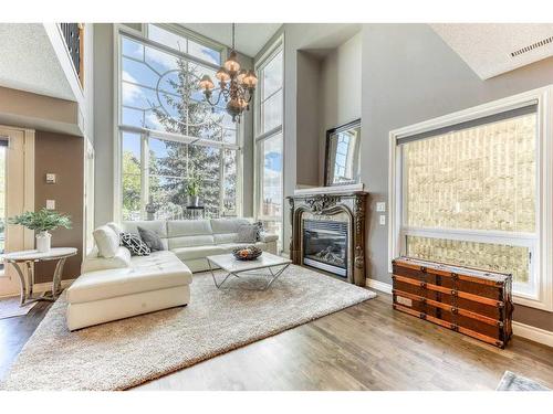 301-2306 17B Street Sw, Calgary, AB - Indoor Photo Showing Living Room With Fireplace