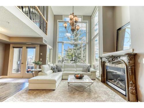 301-2306 17B Street Sw, Calgary, AB - Indoor Photo Showing Living Room With Fireplace