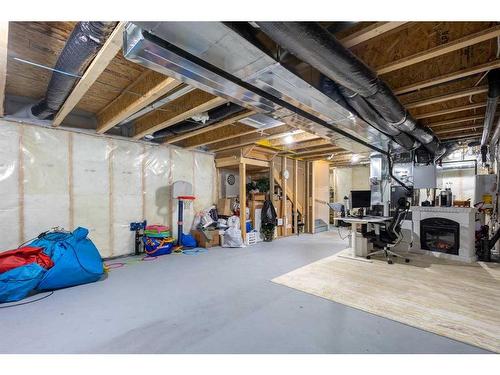 60 Wolf Creek Street Se, Calgary, AB - Indoor Photo Showing Basement